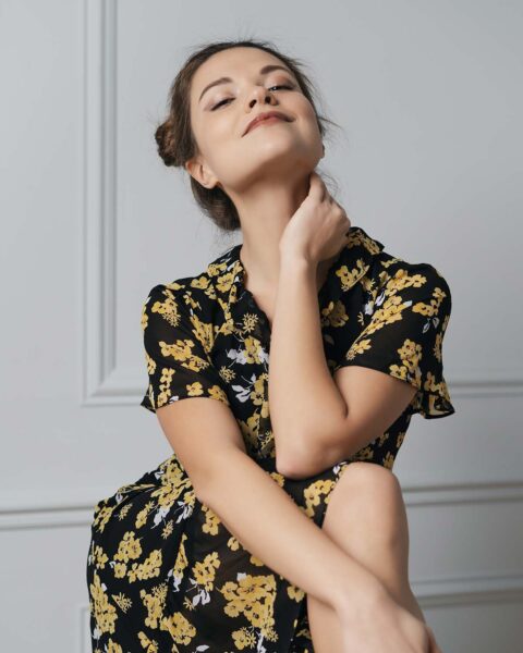 attractive-young-woman-dressed-in-floral-dress-8LKYX2Z.jpg